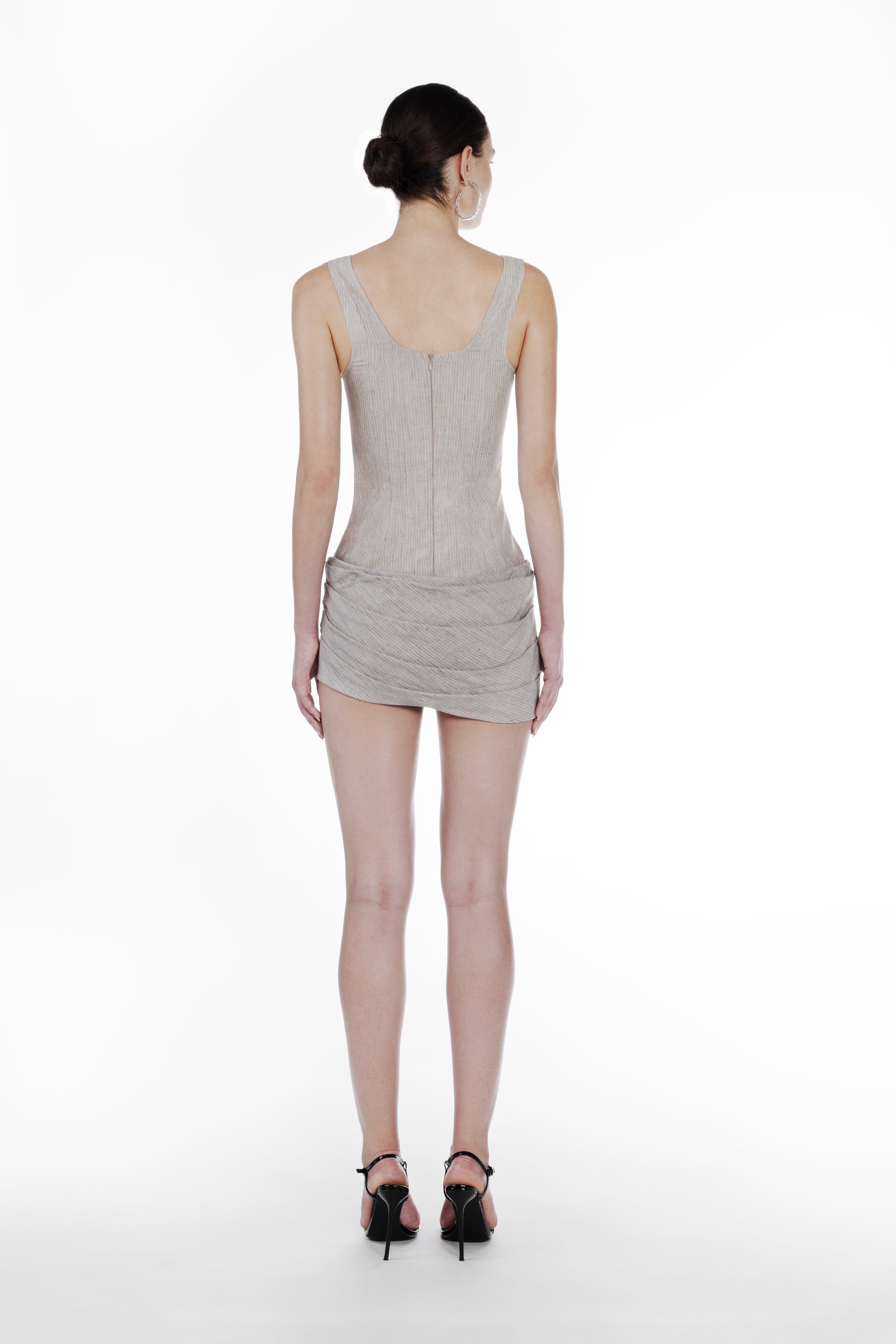 Linen Stripes Bodydress in cold beige, back view of the sleeveless striped mini dress with fitted silhouette and draped skirt detail