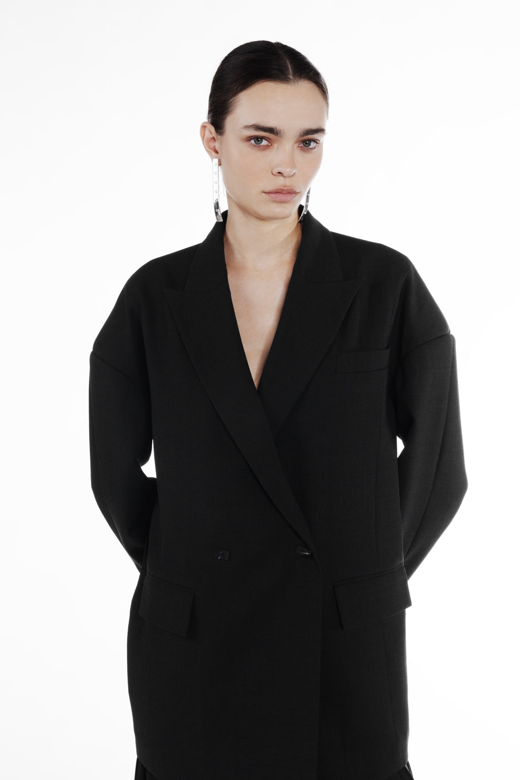 Falling Shoulder Double-Breasted Jacket black virgin wool detail view with peaked lapels and relaxed tailored silhouette