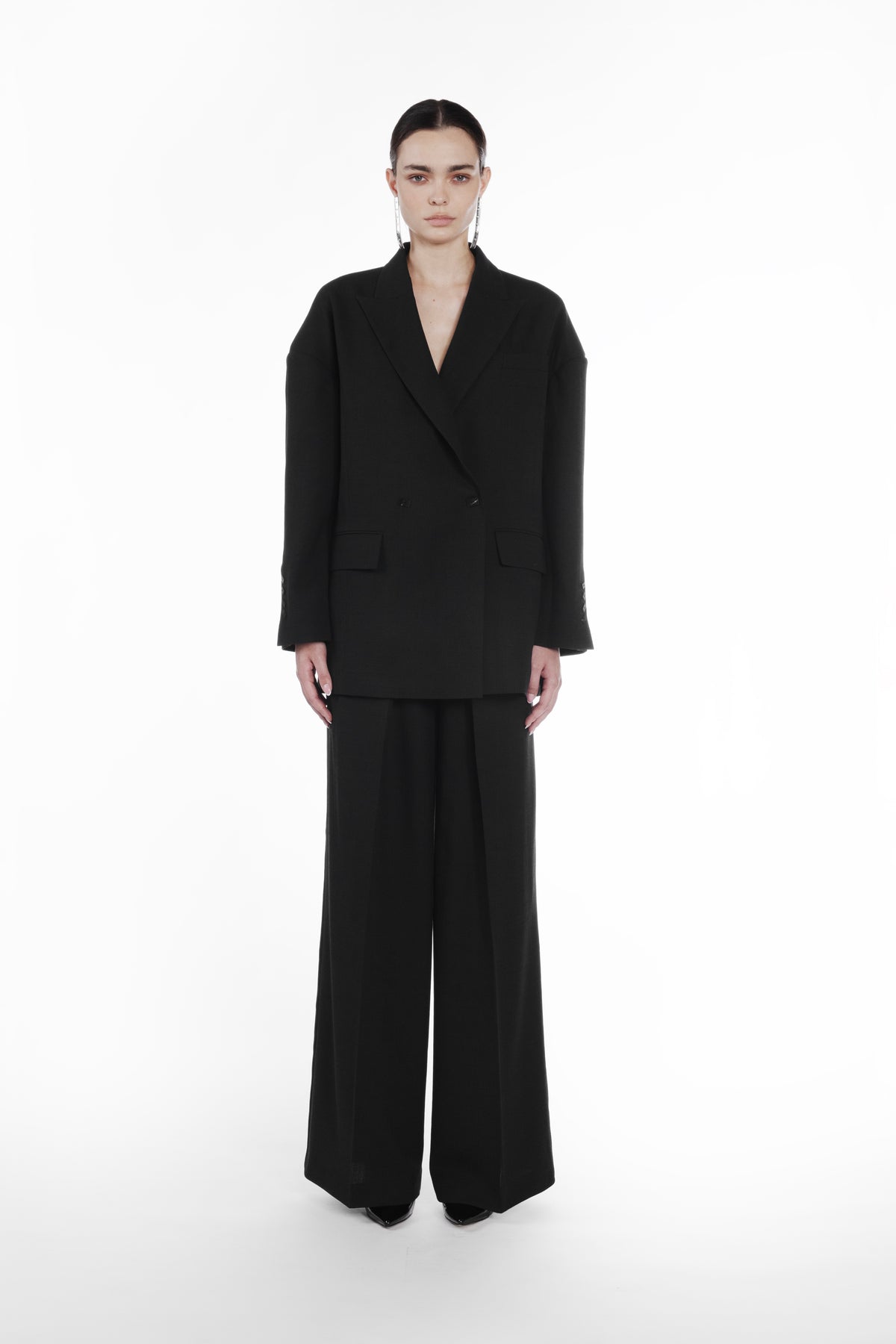 Falling Shoulder Double-Breasted Jacket black front view with wide-leg trousers and dropped shoulder tailoring