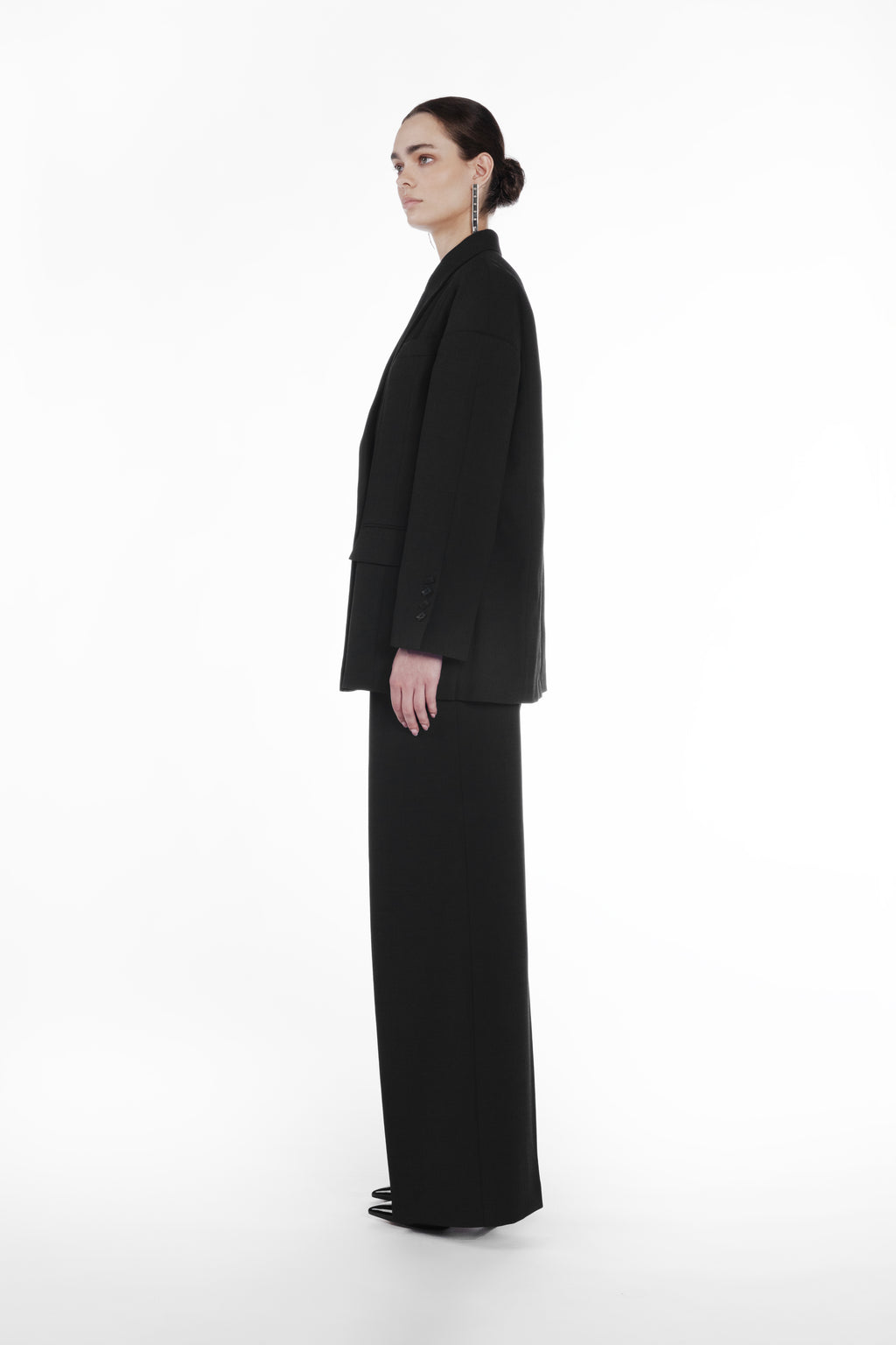 Falling Shoulder Double-Breasted Jacket black side view with elongated fit and structured virgin wool silhouette