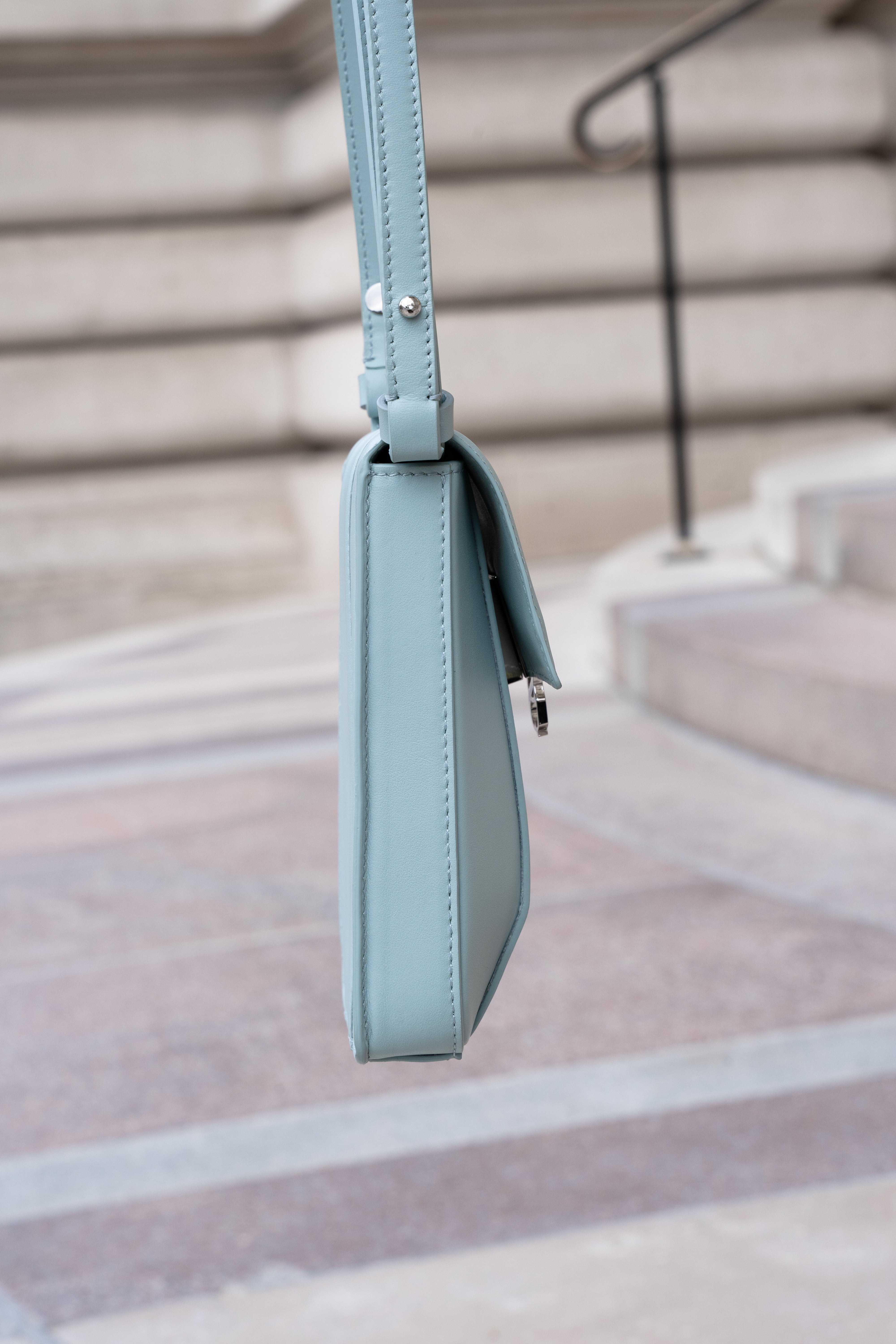 Clear aqua Il Cupolina bag side profile in Italian leather with slim structured silhouette
