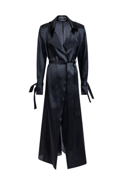 Women’s black silk trench coat with belt and wide lapels, front view.