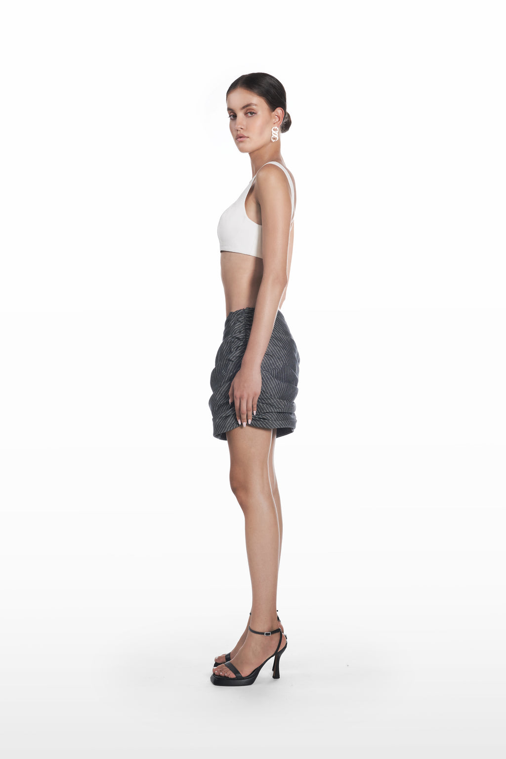 Falling Palla Stripes Skirt in dark grey pinstripe, side view, gathered draped mini shape