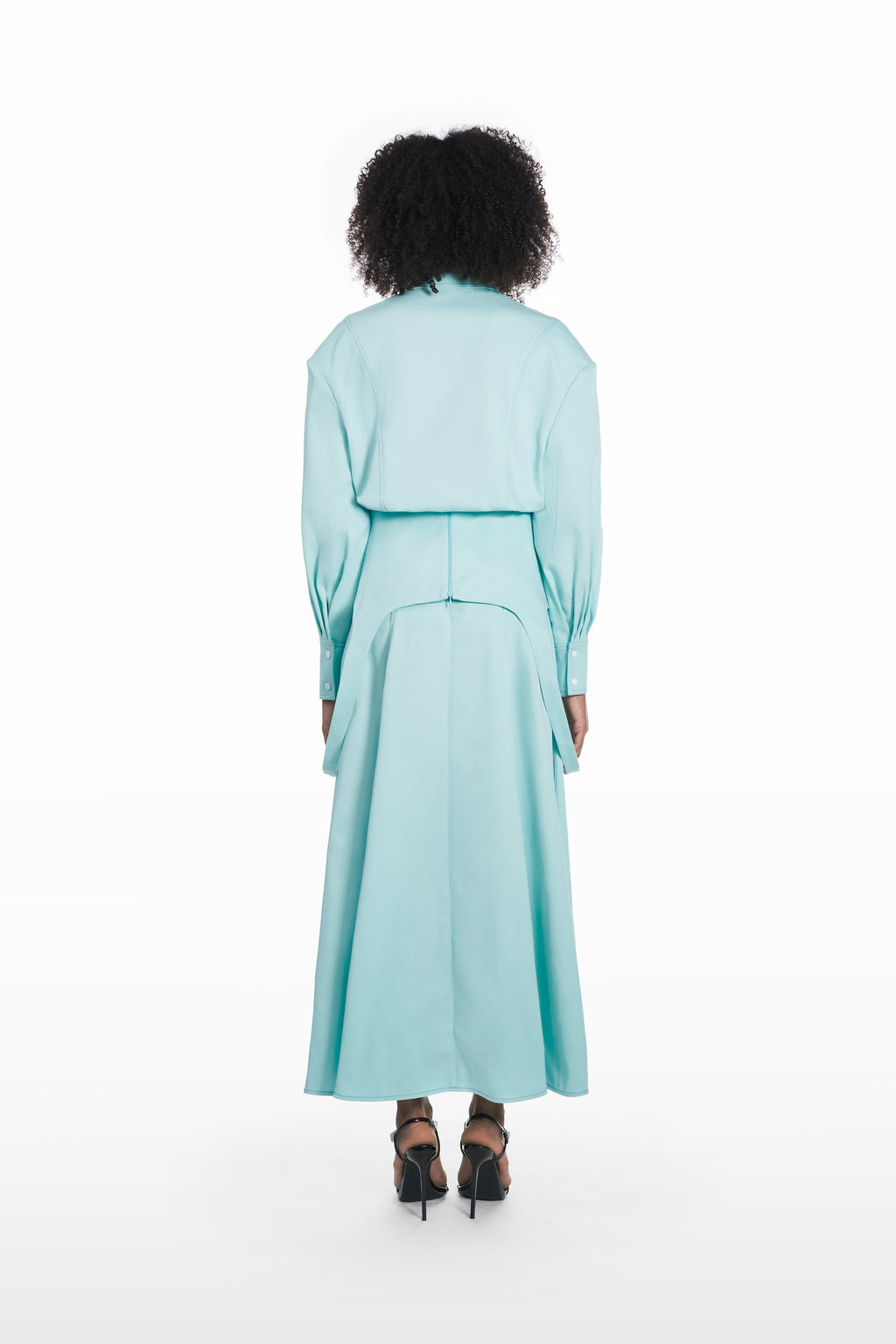 Falling maxi skirt in clear aqua, back view with fluid maxi silhouette and clean architectural fall styled with a matching blouse