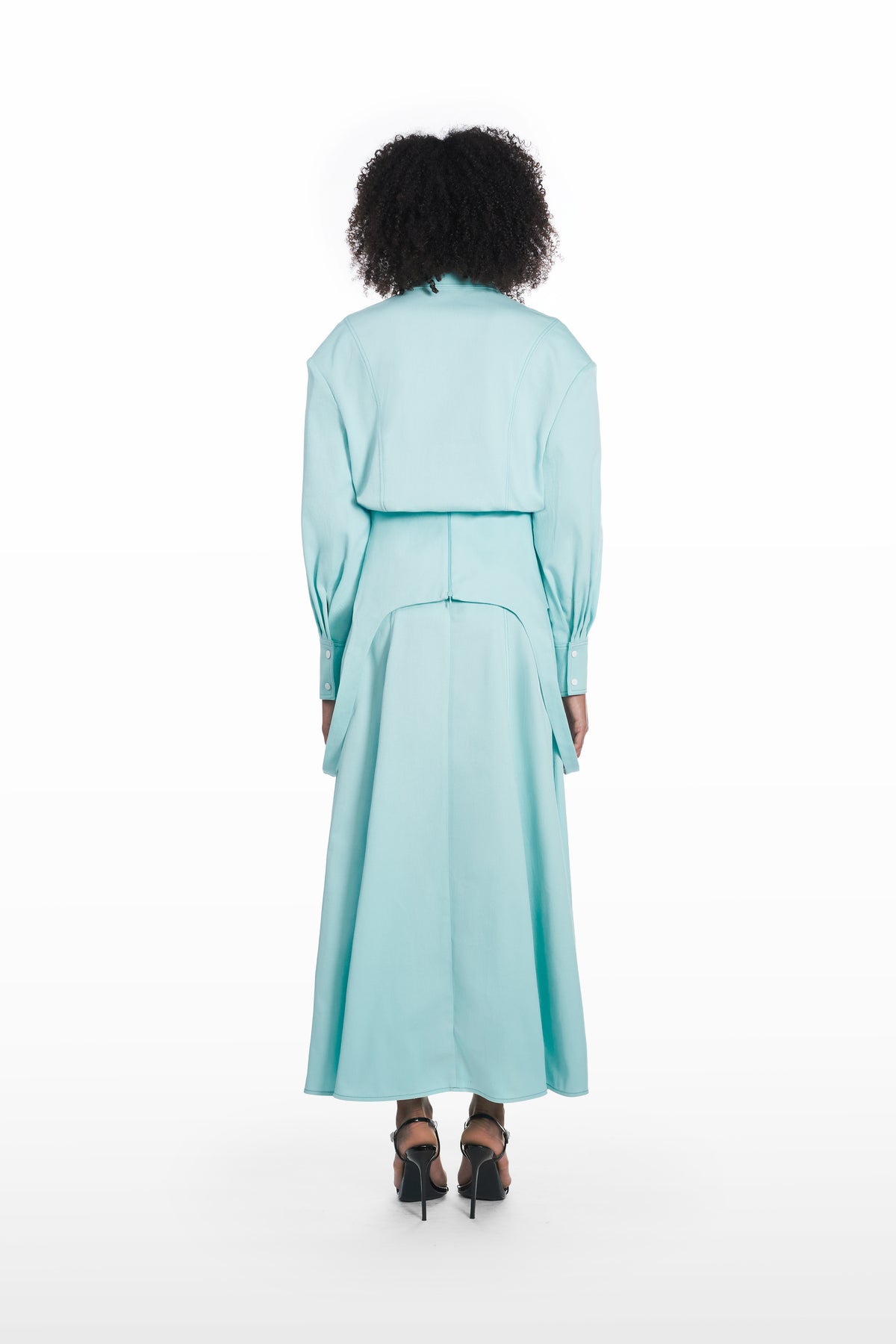 Falling maxi skirt in clear aqua, back view with fluid maxi silhouette and clean architectural fall styled with a matching blouse