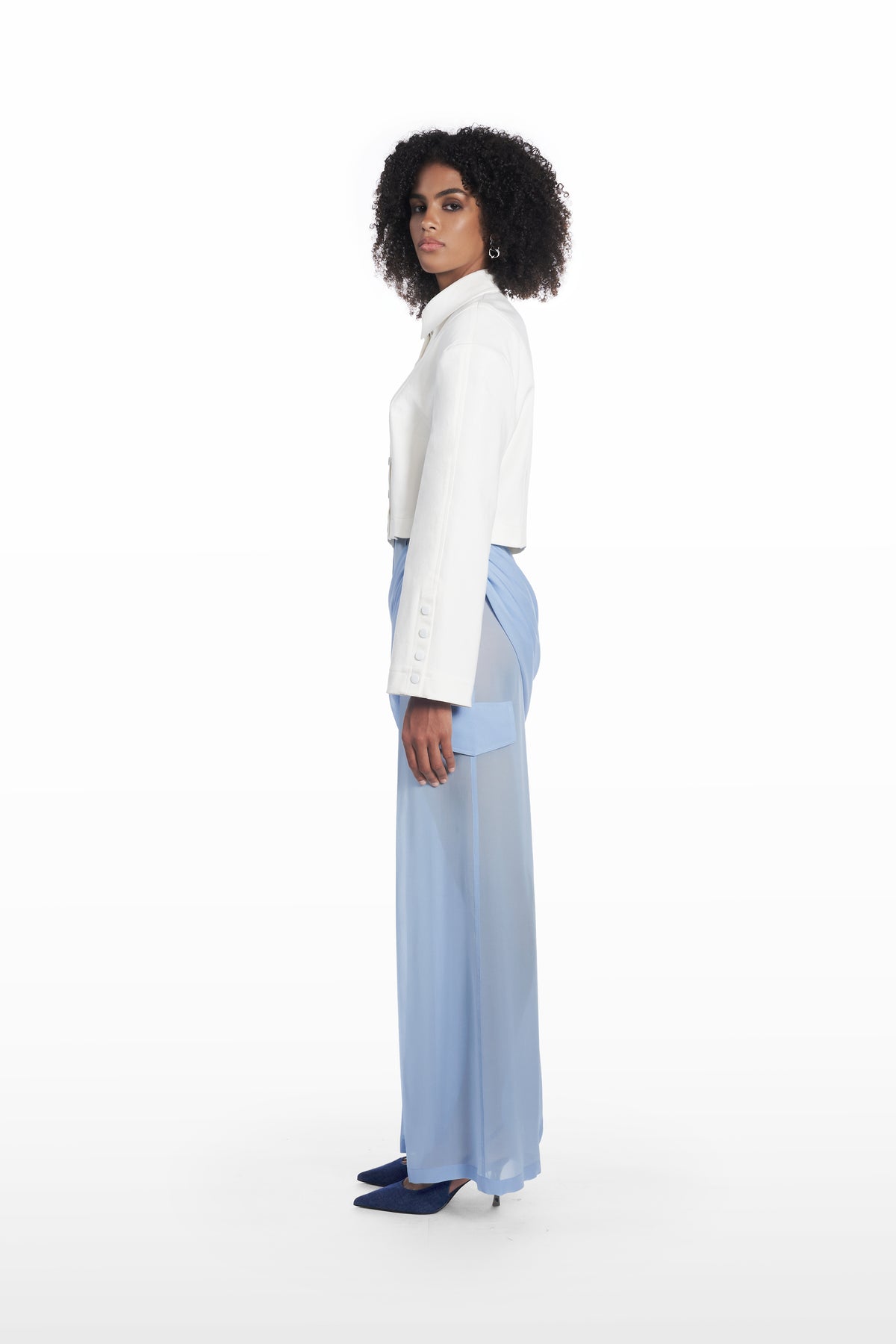 Transparent Palla trousers in clear aqua, side view with fluid straight-leg silhouette and soft transparent finish