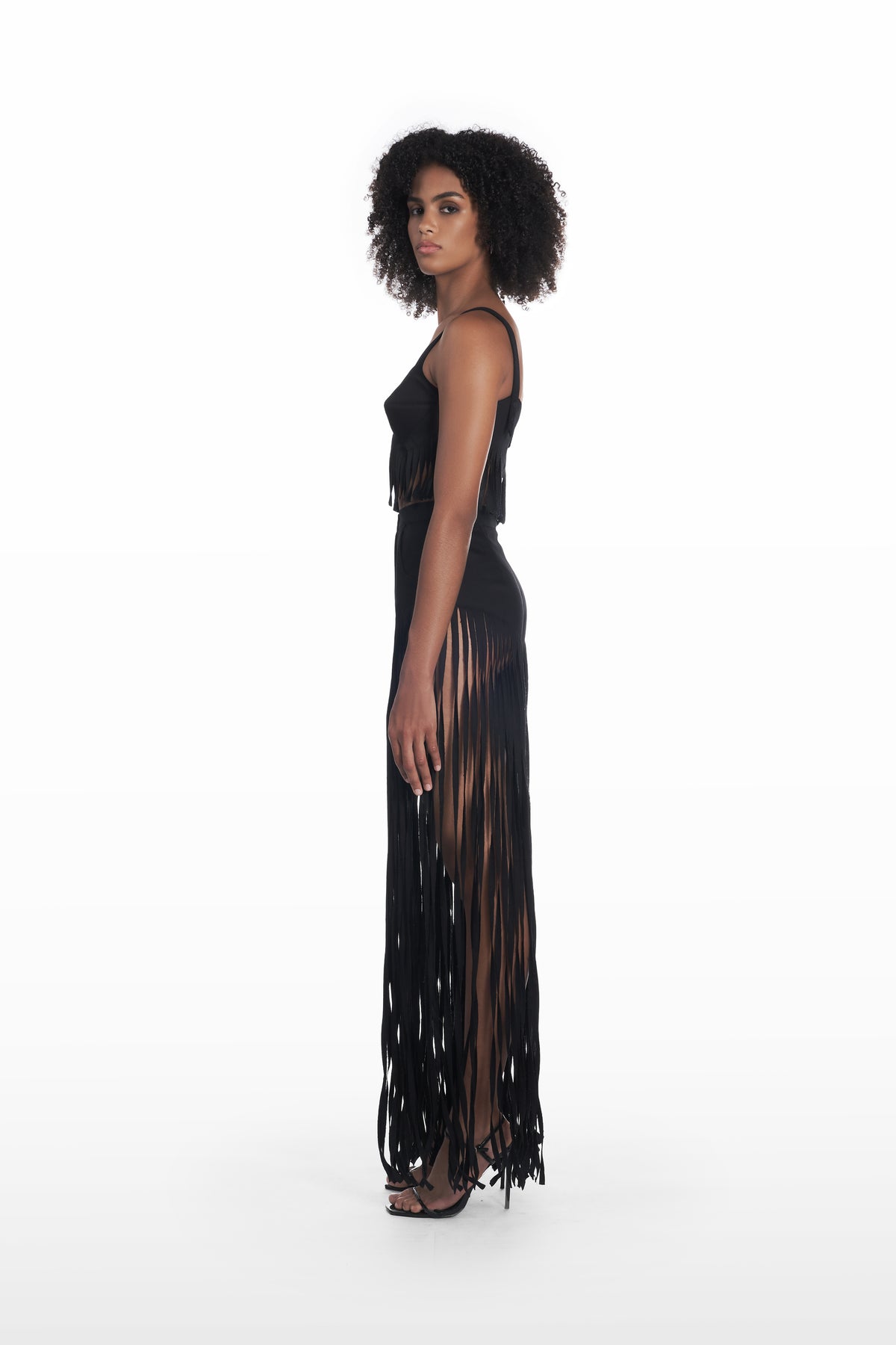 Denim Fringe Trousers in black, side view, fitted waist and elongated fringe detail