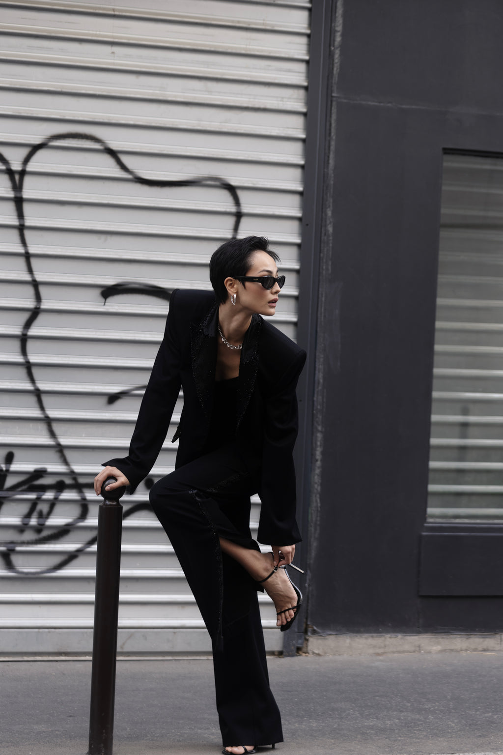 Black couture tuxedo look on model styled in the street