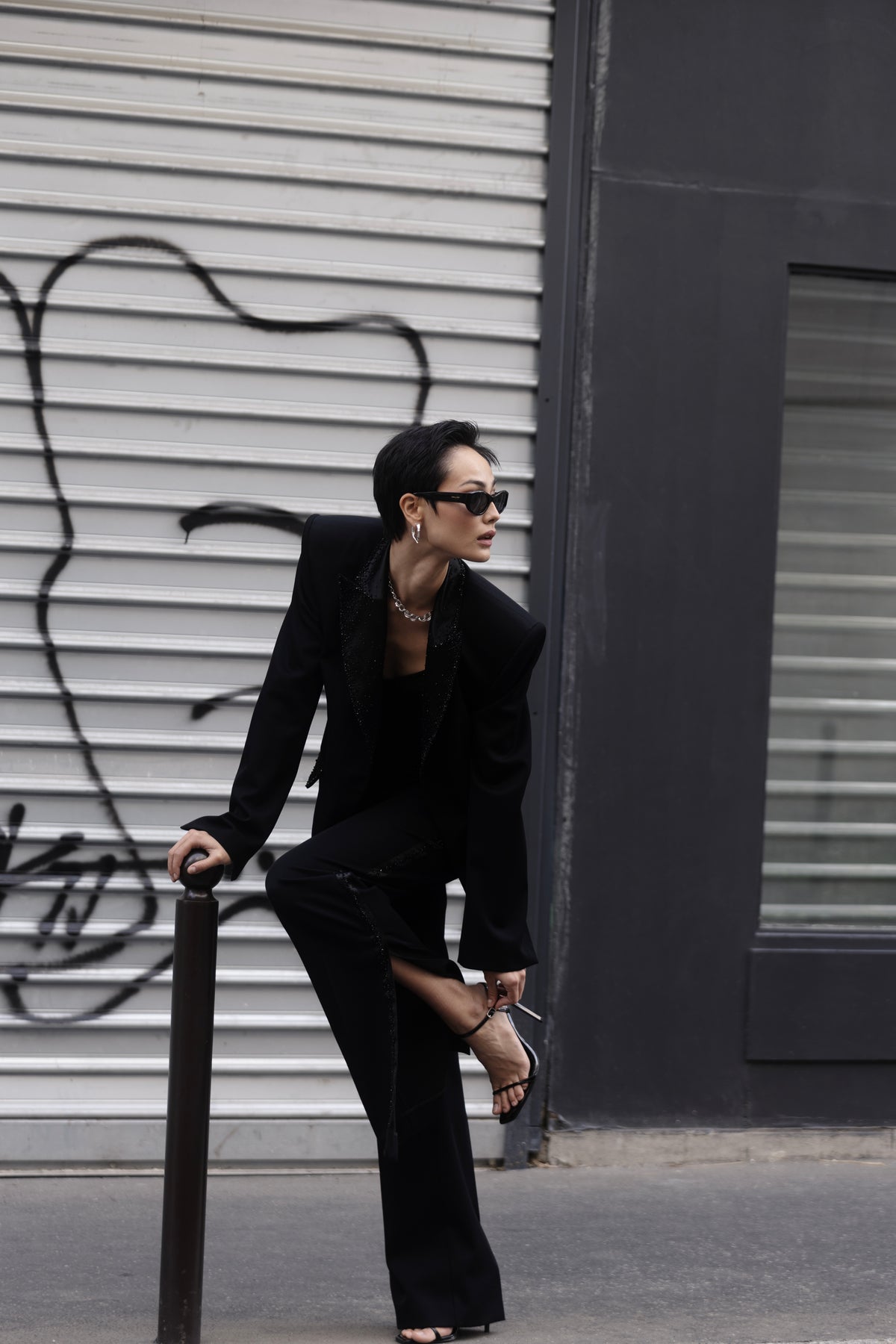 Black couture tuxedo look on model styled in the street