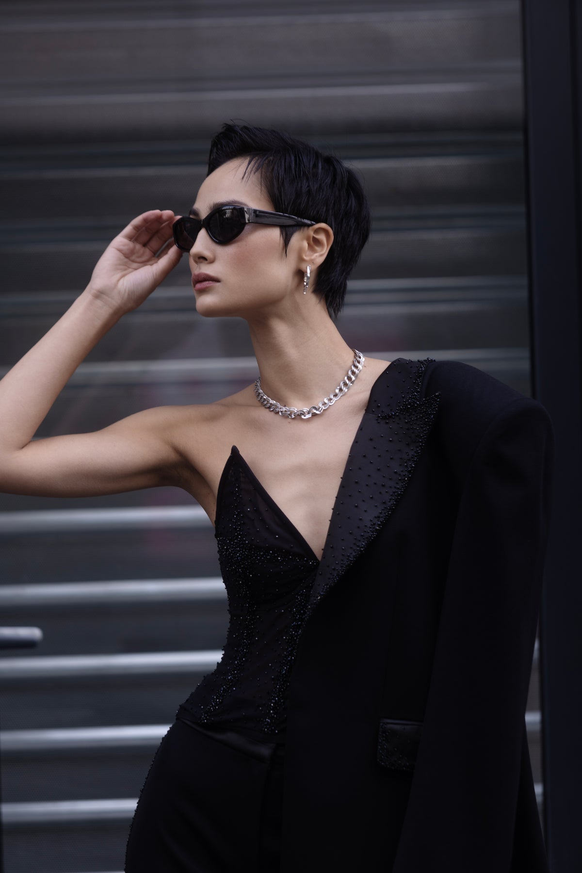 Black crystal embroidered tuxedo layered over eveningwear close-up on model