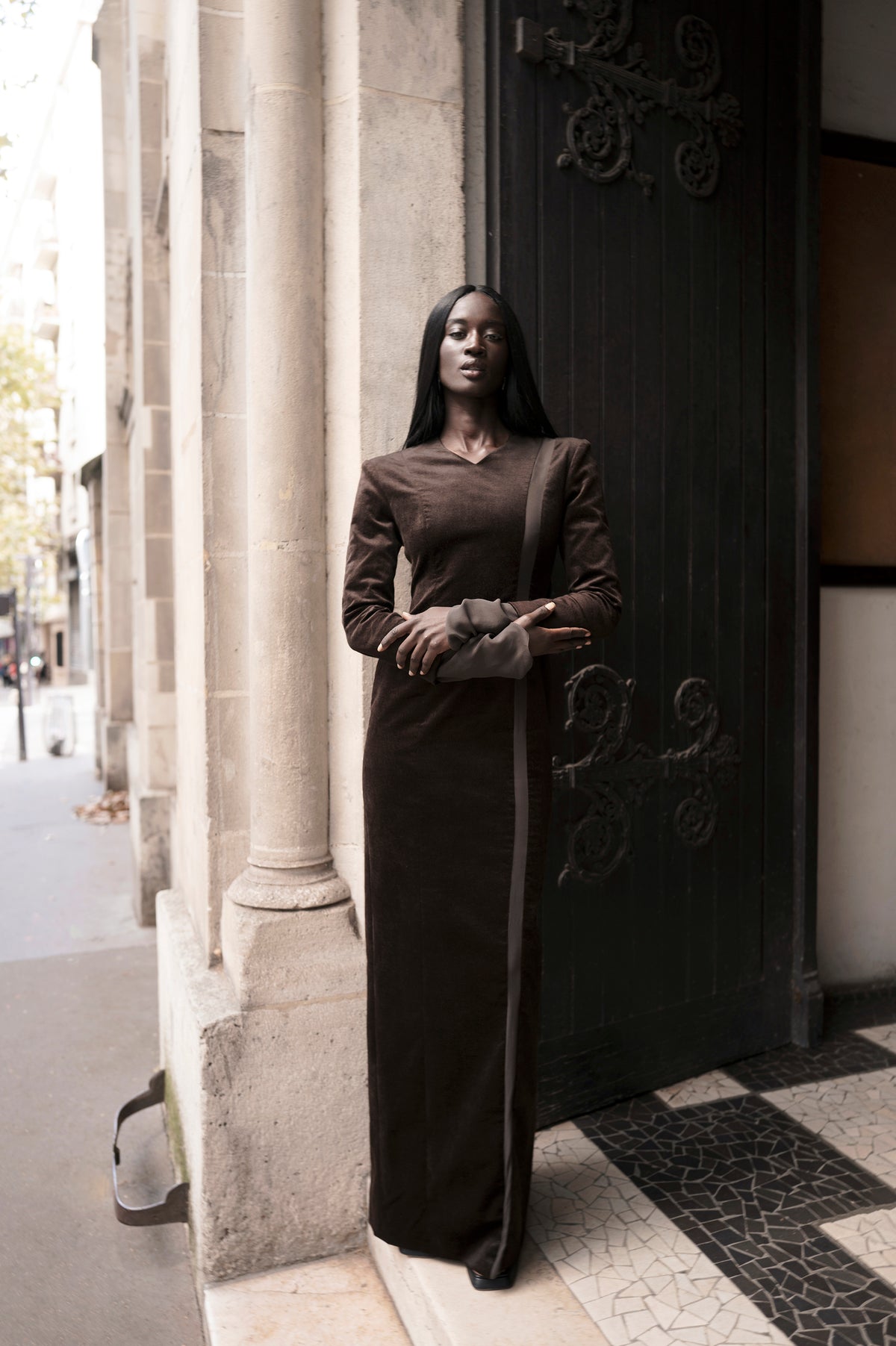 Black floor-length dress with silk detail, front full-length view on model