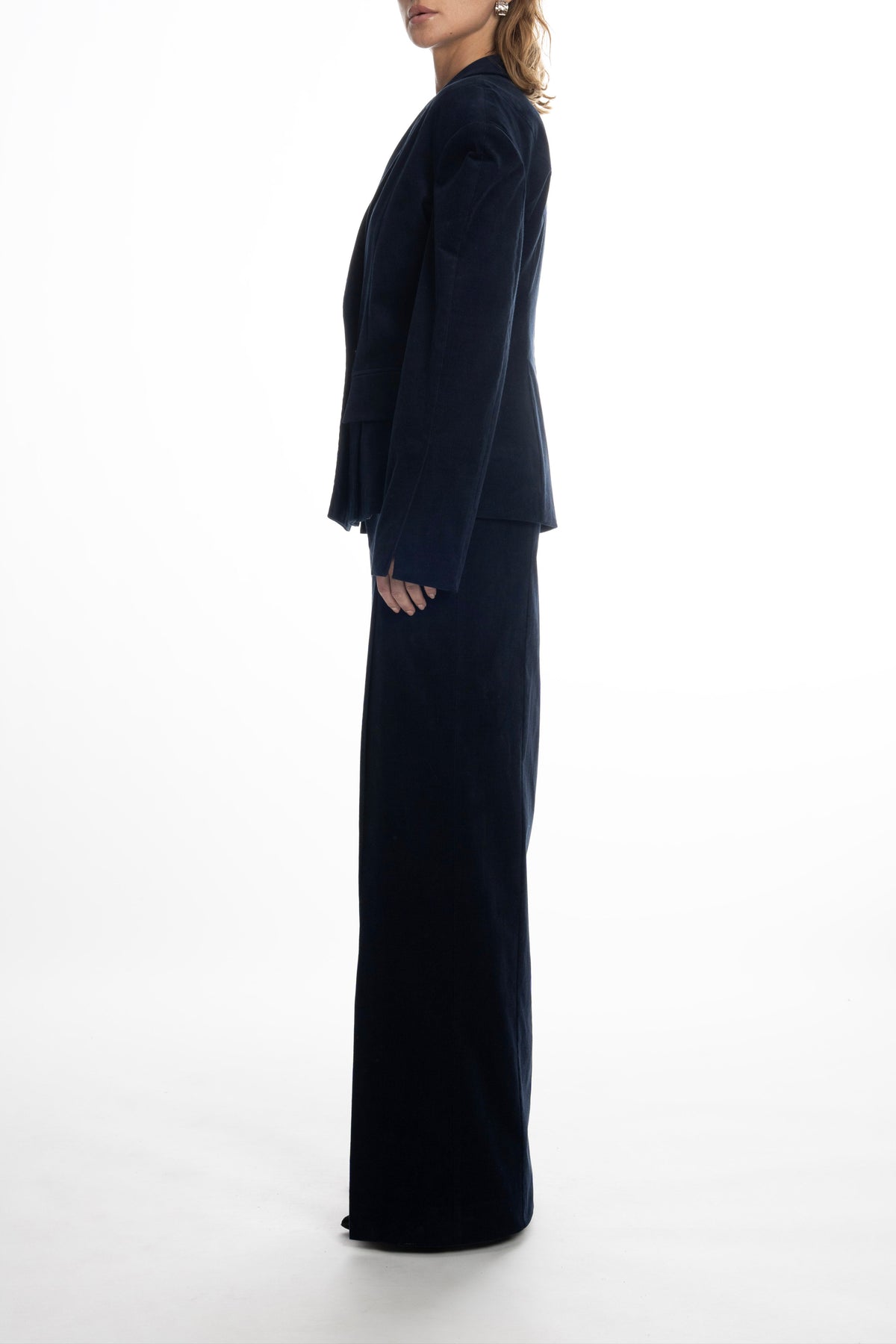 Model wearing navy Falling Shoulders blazer with matching long skirt