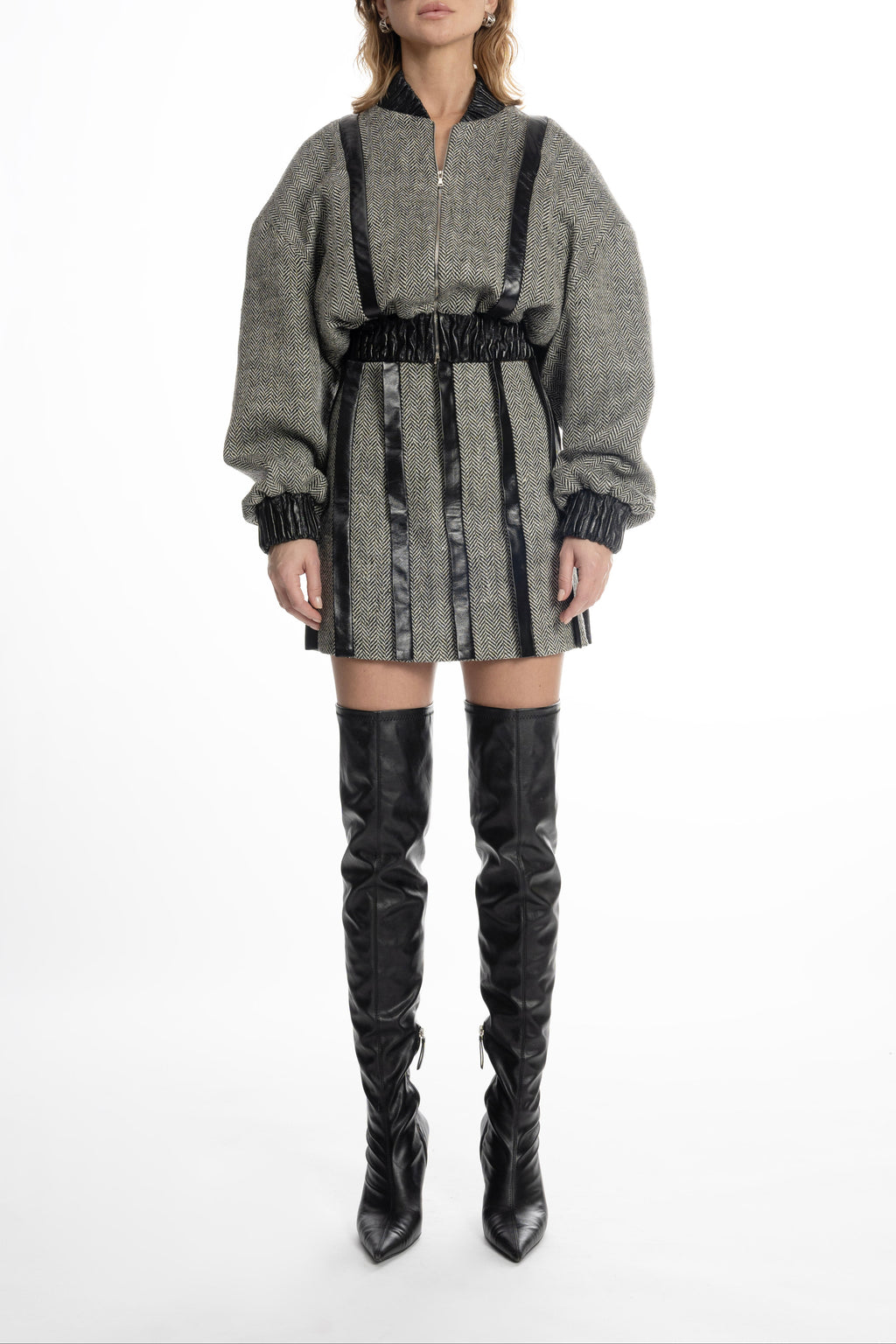 Women’s grey tweed mini skirt with leather placket stripes, front view on model
