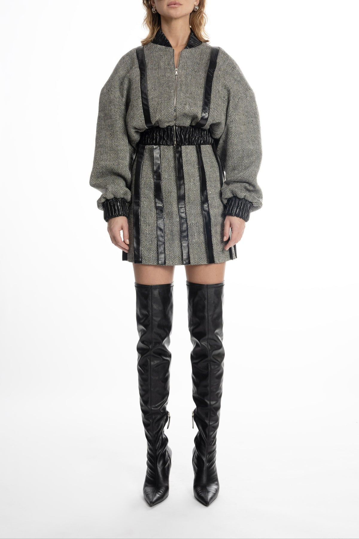 Women’s grey tweed mini skirt with leather placket stripes, front view on model
