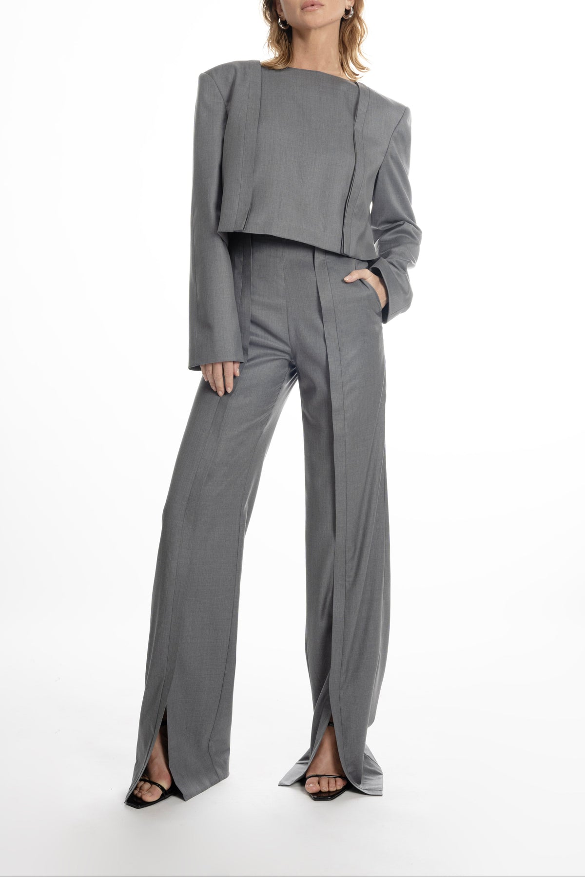 Open Shoulder Short Jacket in light grey, architectural panels and open shoulders emphasized