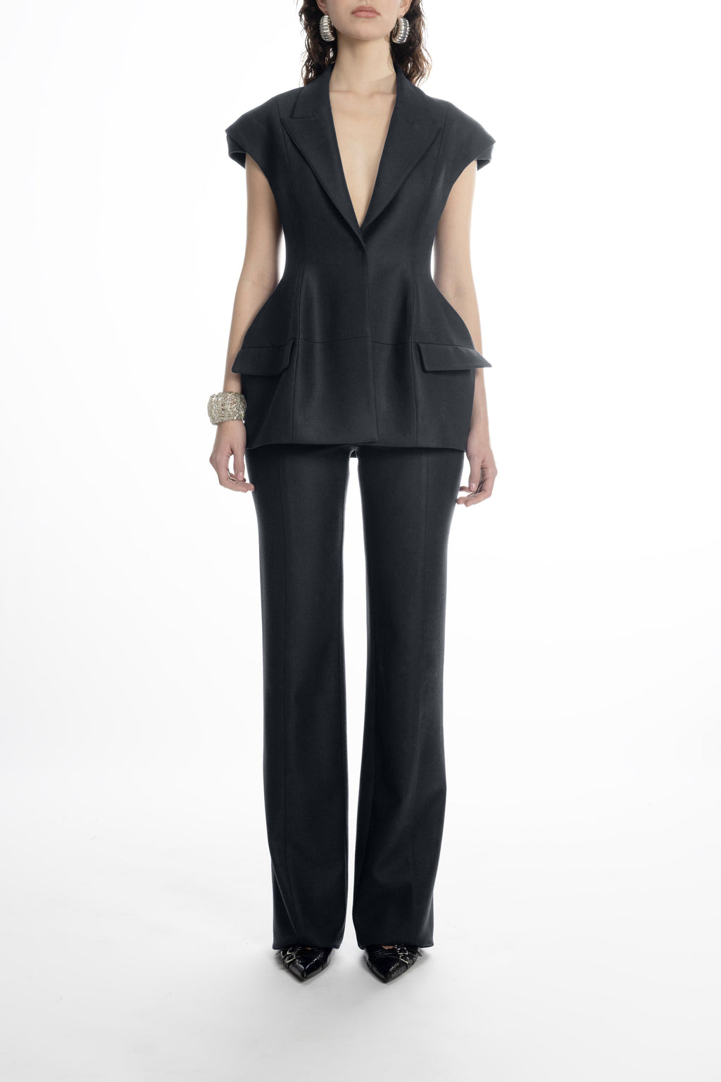 Women’s black hip-length blazer with sharp lapels and cap sleeves