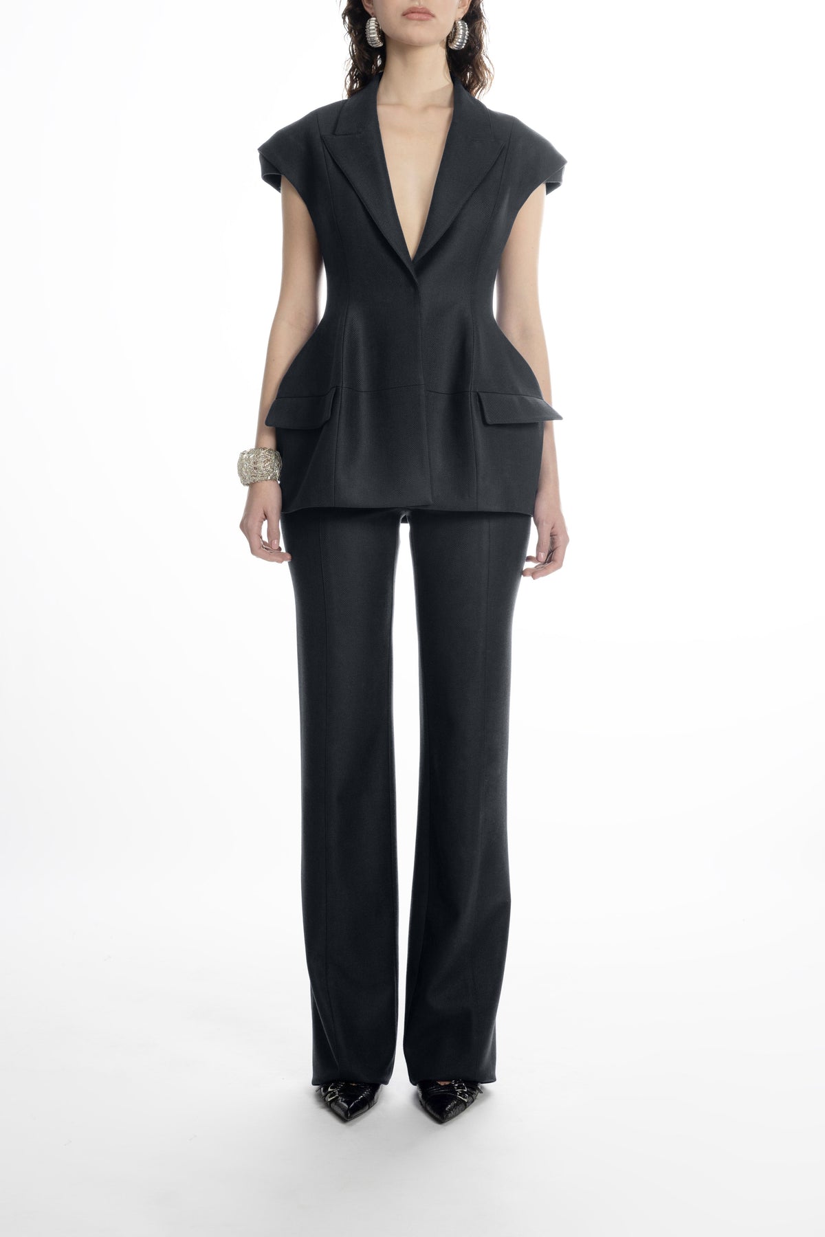 Women’s black hip-length blazer with sharp lapels and cap sleeves