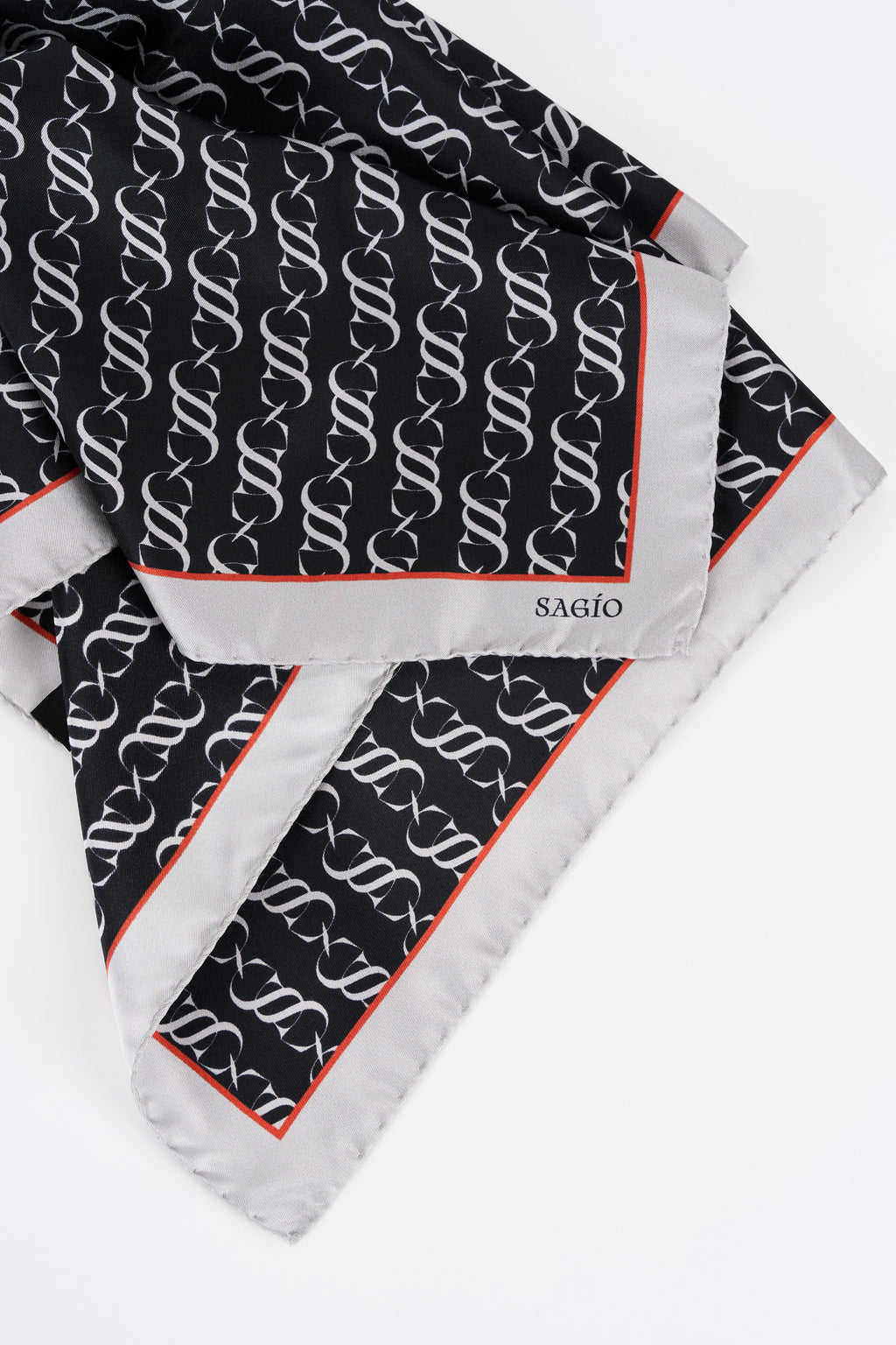 Graphite designer silk carré scarf with monogram pattern in folded detail view
