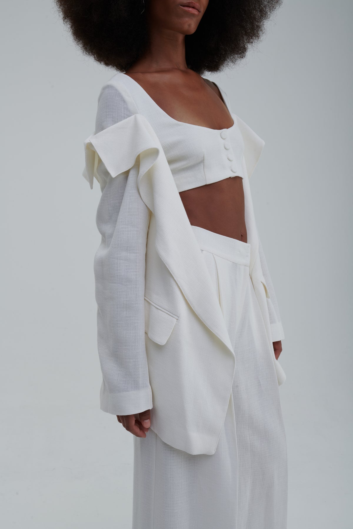 White textured linen-cotton, front detail with covered buttons