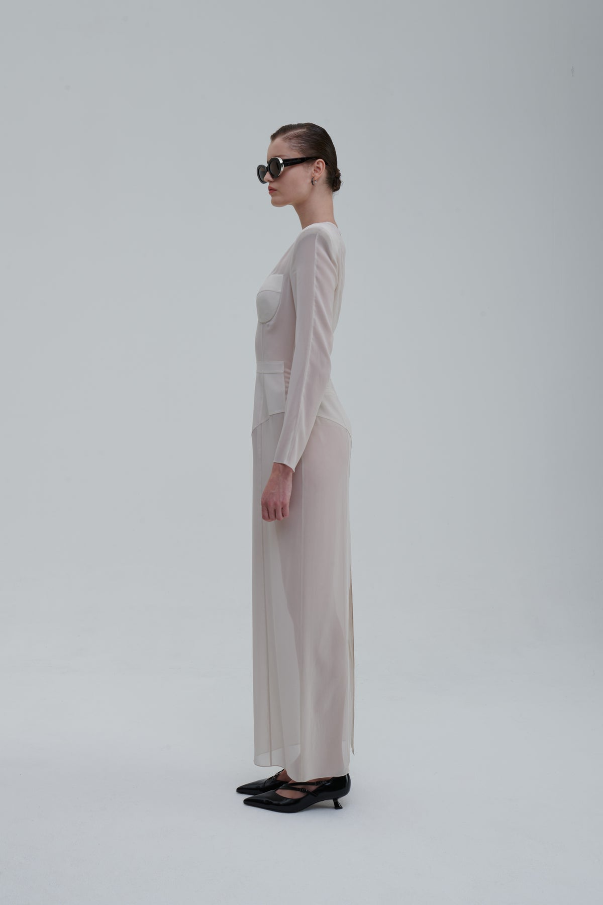 Underwear Application Dress in ivory sheer silk, side view showing bustier cups and long sleeves