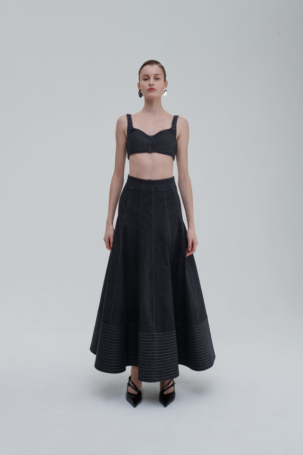 Model wearing SAGIO Quilted Denim Top with matching denim skirt, full front view