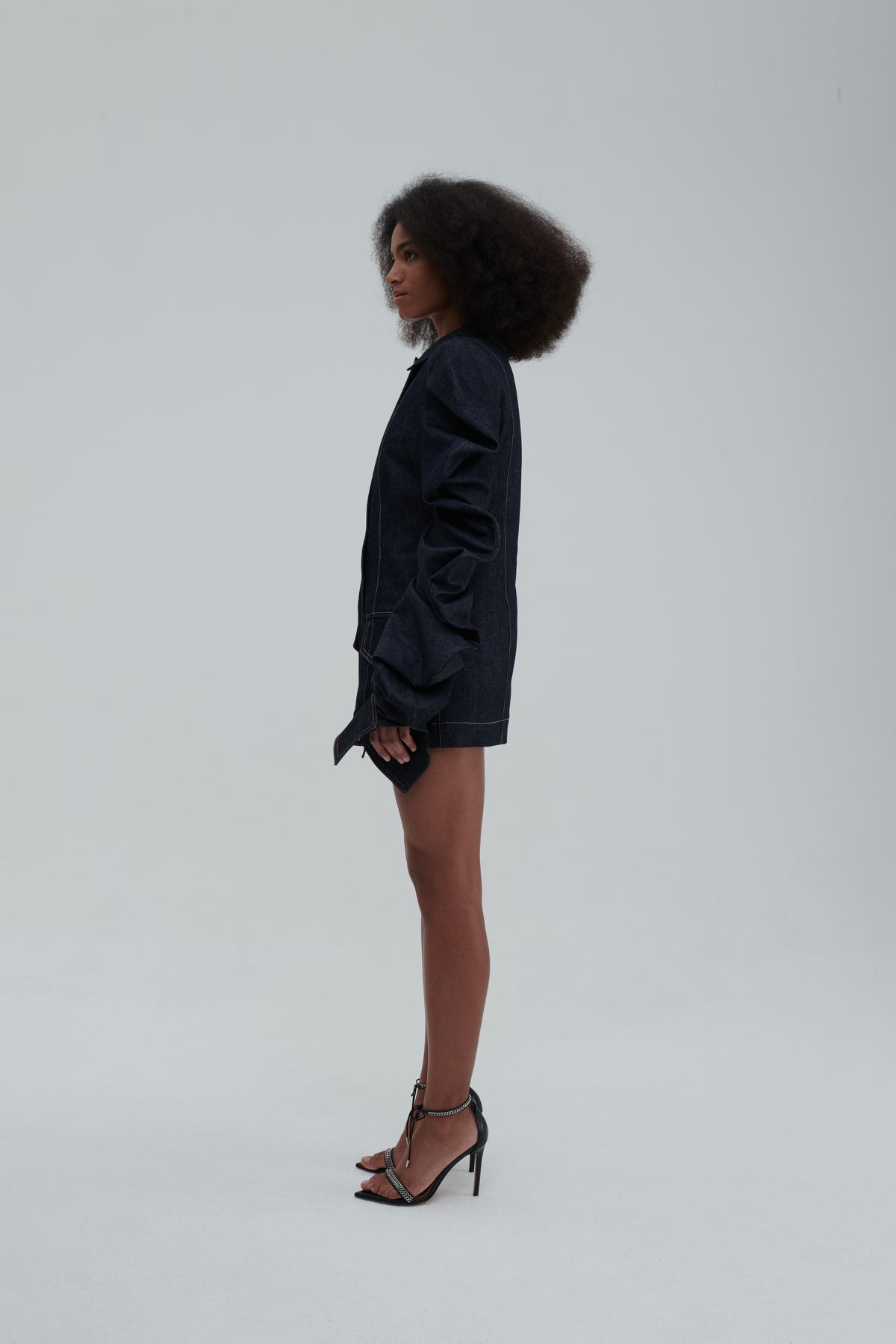 MEDUSA DENIM PARKA by Sagio from the Spring/Summer 2025 collection — a structured, sculptural denim parka with voluminous sleeves, architectural draping, and an avant-garde silhouette. Explore modern statement outerwear at thesagio.com