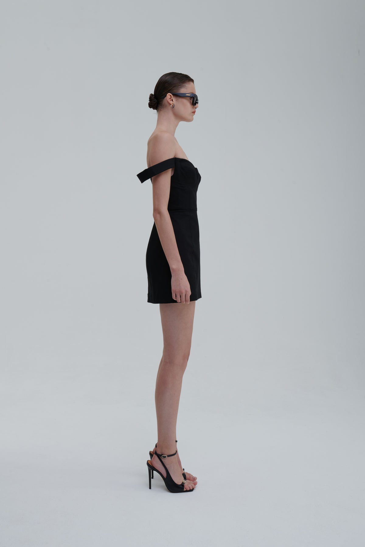 FALLING STRAPS DRESS by Sagio from the Spring/Summer 2025 collection — an asymmetrical black dress with layered falling straps, a fitted bodice, and deconstructed detailing. Bold conceptual eveningwear from thesagio.com.