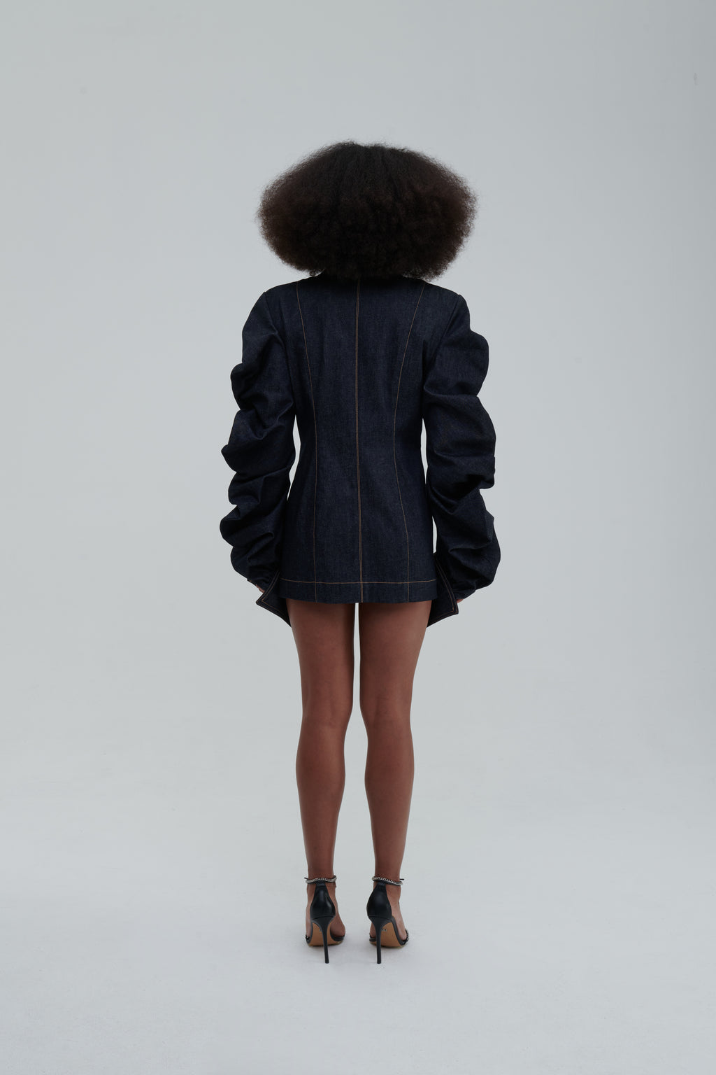 MEDUSA DENIM PARKA by Sagio from the Spring/Summer 2025 collection — a structured, sculptural denim parka with voluminous sleeves, architectural draping, and an avant-garde silhouette. Explore modern statement outerwear at thesagio.com