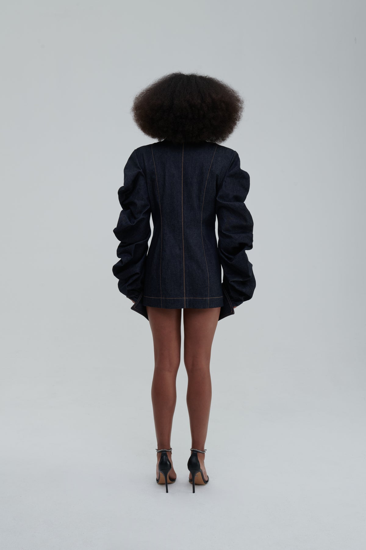 MEDUSA DENIM PARKA by Sagio from the Spring/Summer 2025 collection — a structured, sculptural denim parka with voluminous sleeves, architectural draping, and an avant-garde silhouette. Explore modern statement outerwear at thesagio.com