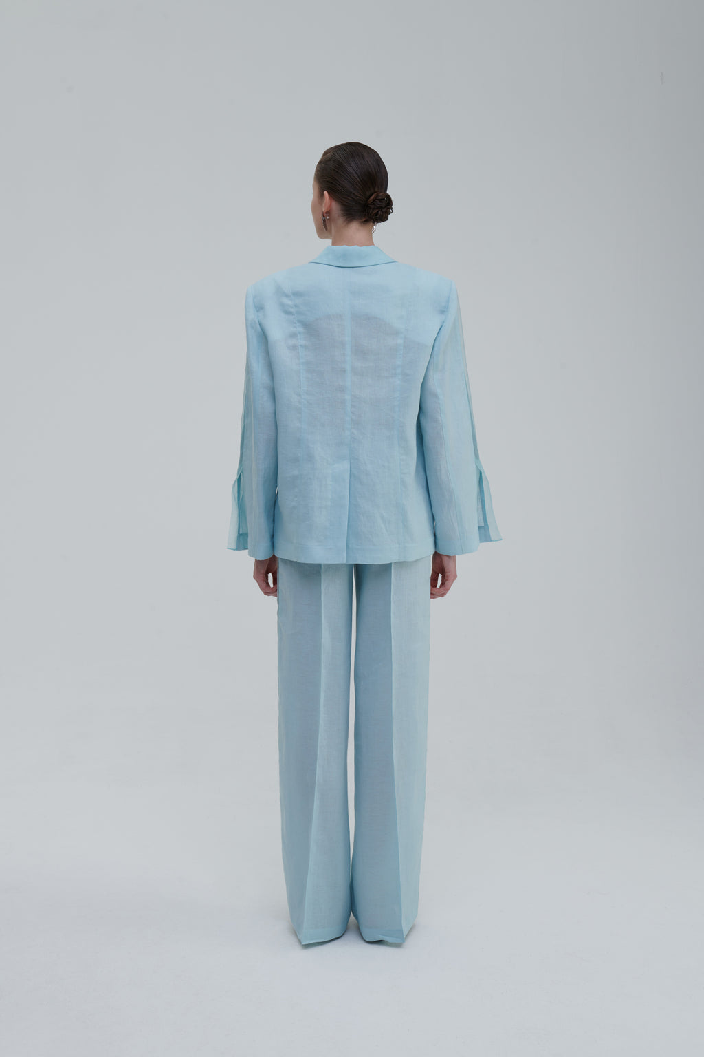 Light blue wide-leg trousers back view on model