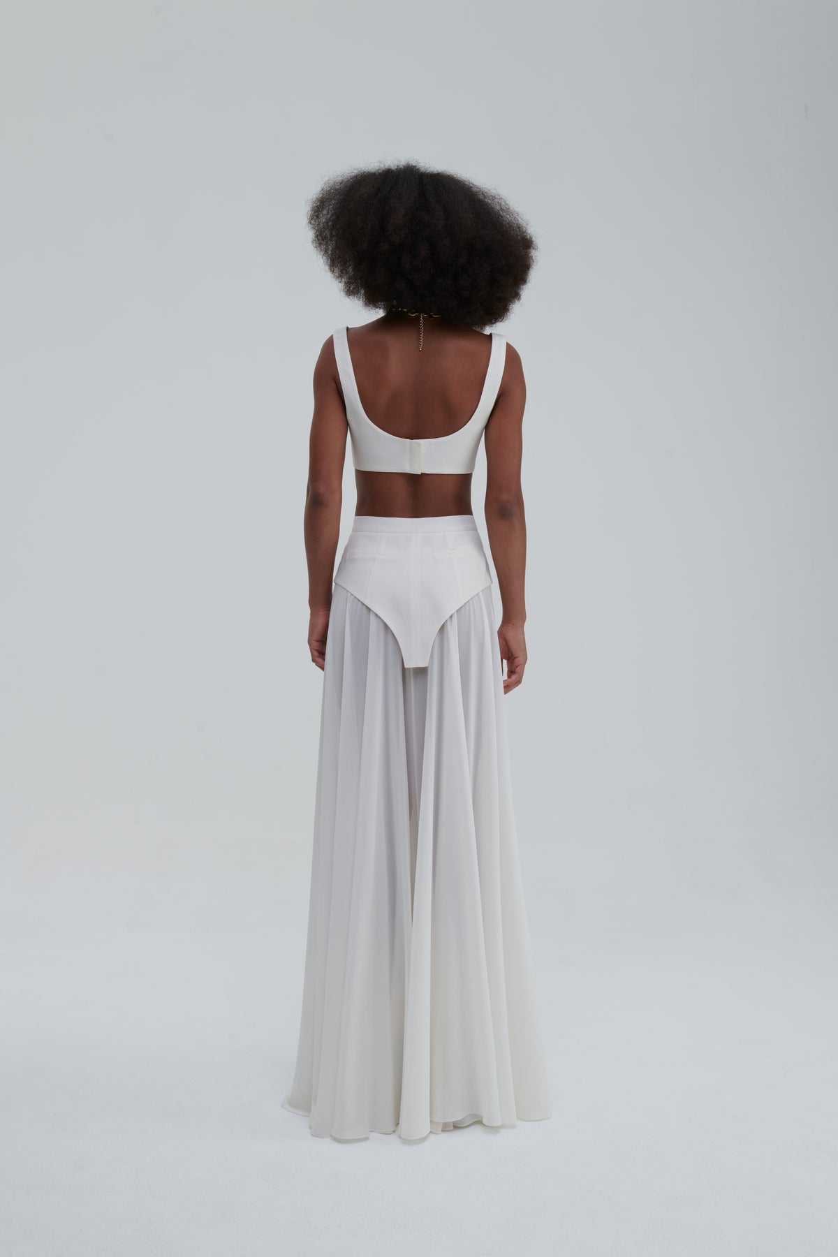 MAXI UNDERWEAR APPLICATION SKIRT by Sagio from the Spring/Summer 2025 collection — a sheer white maxi skirt featuring underwear-inspired paneling and elegant draping. Conceptual designer fashion in lightweight fabric from thesagio.com