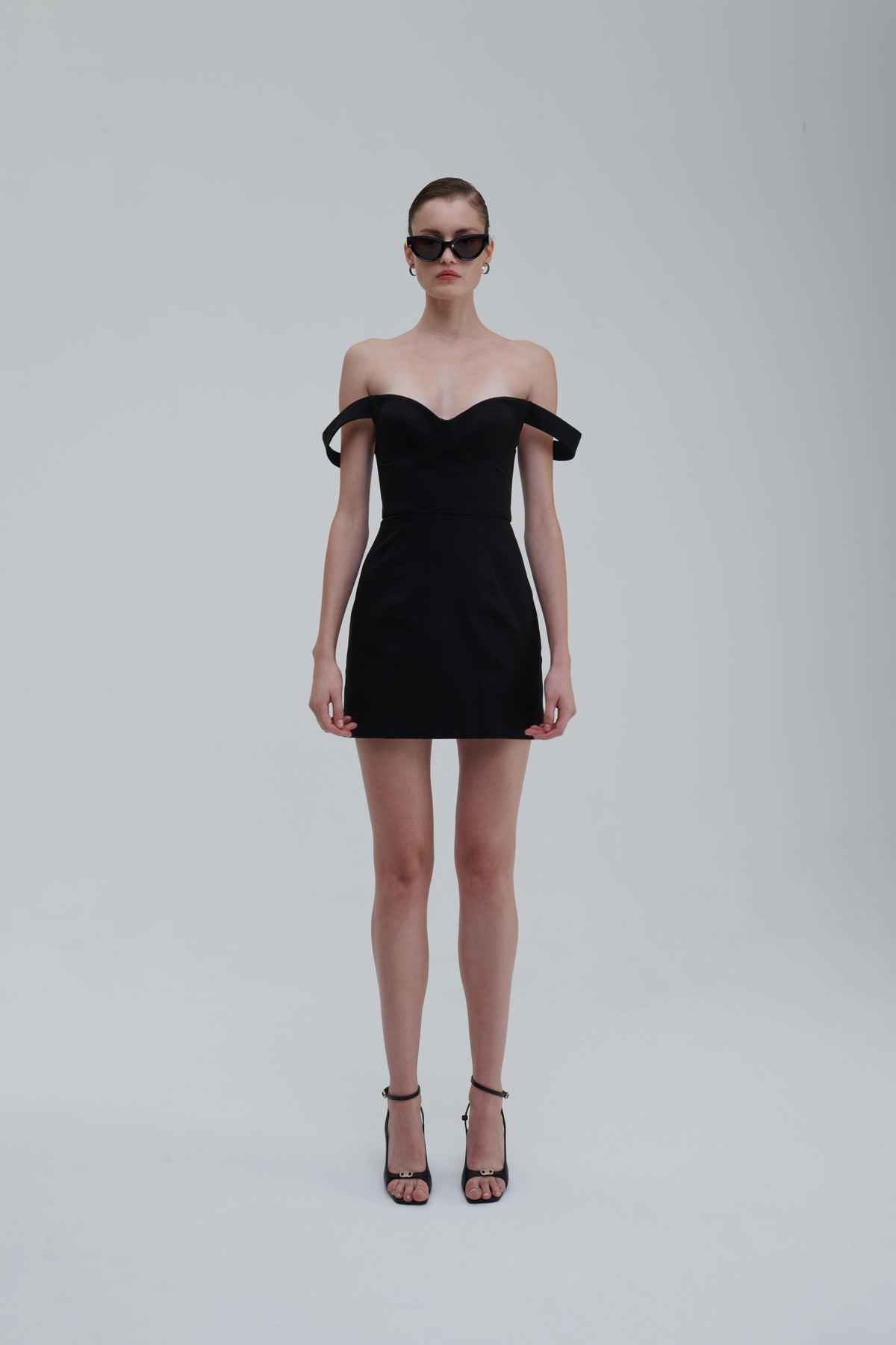 FALLING STRAPS DRESS by Sagio from the Spring/Summer 2025 collection — an asymmetrical black dress with layered falling straps, a fitted bodice, and deconstructed detailing. Bold conceptual eveningwear from thesagio.com.