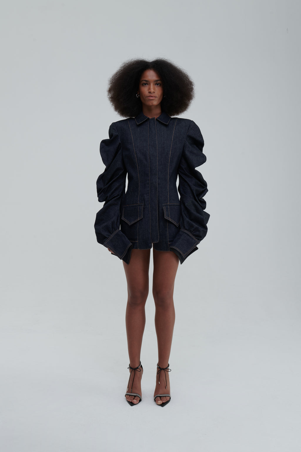 MEDUSA DENIM PARKA by Sagio from the Spring/Summer 2025 collection — a structured, sculptural denim parka with voluminous sleeves, architectural draping, and an avant-garde silhouette. Explore modern statement outerwear at thesagio.com
