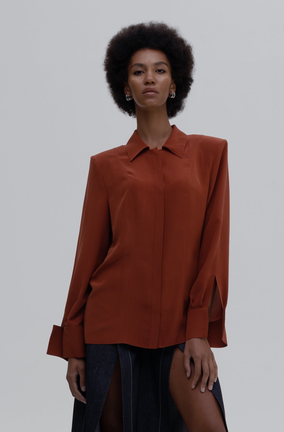 Silk Shirt by Sagio featuring a relaxed-fit, long-sleeve red silk blouse with a classic collar and concealed button placket.