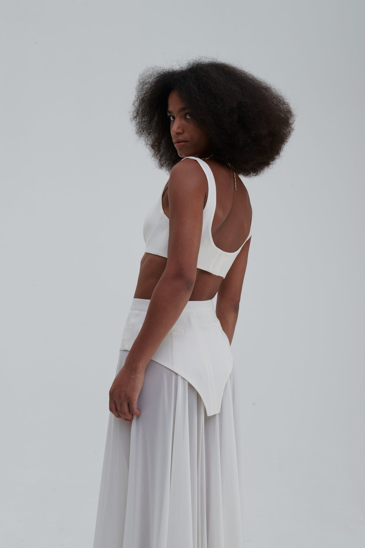 MAXI UNDERWEAR APPLICATION SKIRT by Sagio from the Spring/Summer 2025 collection — a sheer white maxi skirt featuring underwear-inspired paneling and elegant draping. Conceptual designer fashion in lightweight fabric from thesagio.com